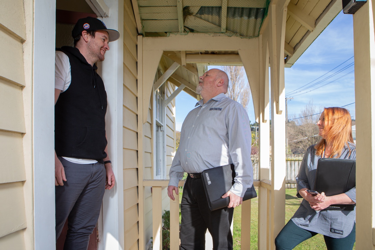 Pair of probation officers visit someone on probation at their house